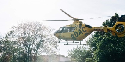 yellow helicopter lands in town scaled