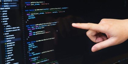finger pointing at javascript code scaled